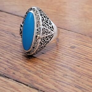 Very nice ornate sterling silver ring. Blue stone. Size 10.